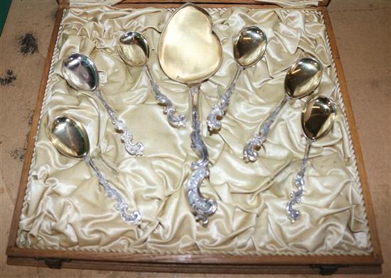 Cased set of German spoons and French set